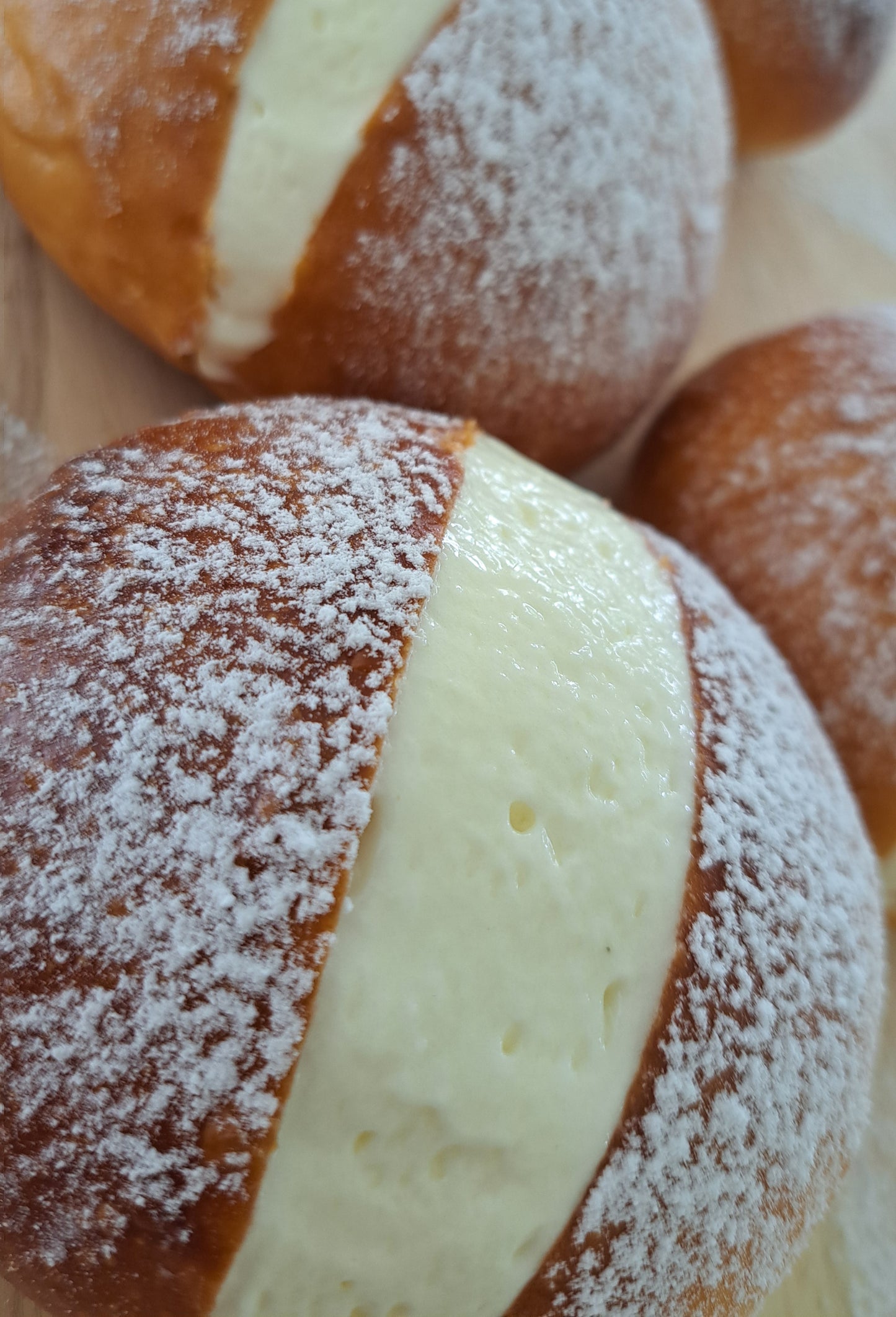 Maritozzi are traditional Italian sweet buns, particularly popular in the Lazio region, especially in Rome. They are typically made from a soft, enriched dough that includes ingredients like flour, sugar, eggs, butter, and milk.